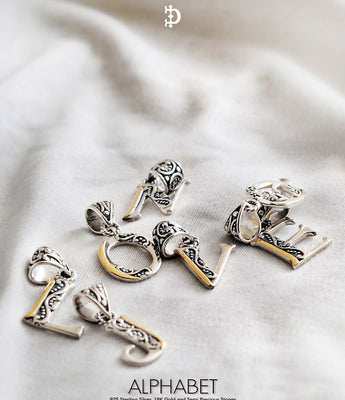 Alphabet silver jewelry collection featuring personalized letter and monogram designs