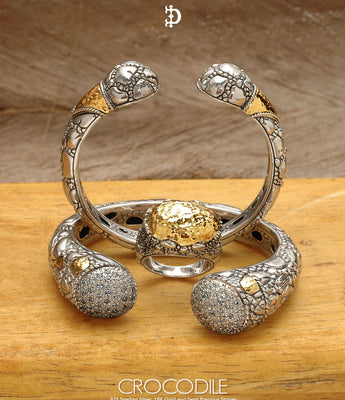 Crocodile scale pattern silver jewelry collection with bold reptile-inspired textured designs